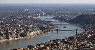 Buildings stands on the banks of the River Danube in Budapest, Hungary. Photographer: Balint Porneczi/Bloomberg