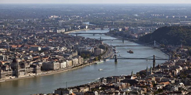Buildings stands on the banks of the River Danube in Budapest, Hungary. Photographer: Balint Porneczi/Bloomberg